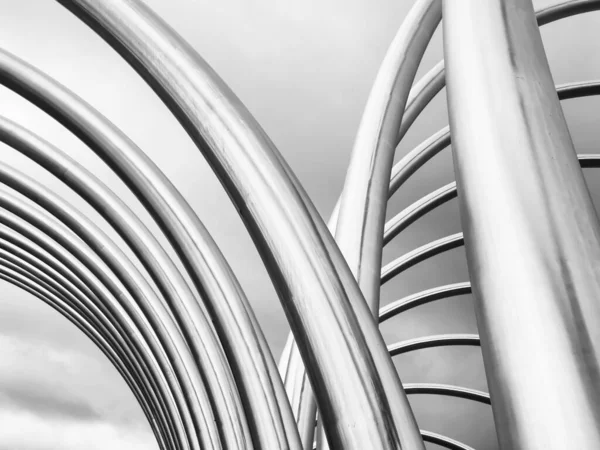 Braided Aluminum Tubes Modern Architecture Curved Pipes Sky Background Image — стоковое фото