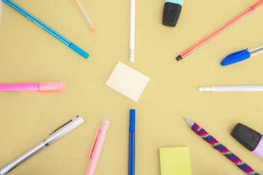 Flatlay from office and school stuff on a colour background.