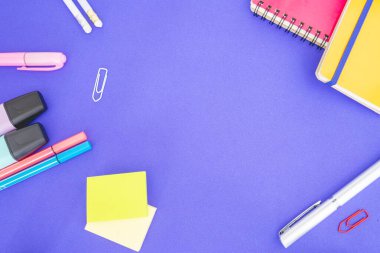 Flatlay from office and school stuff on a colour background.
