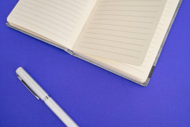 Flatlay from office and school stuff on a colour background.