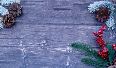 Christmas wooden background with a tet and a Christmas tree toy. clipart