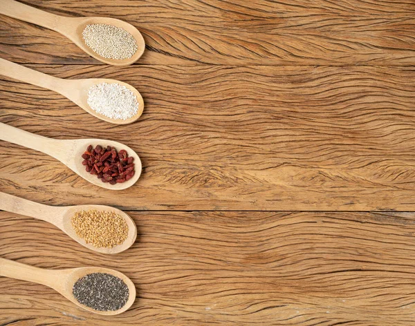 Assorted Superfoods Spoons Wooden Table Copy Space Chia Quinoa Oat — Stockfoto