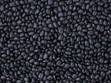 Siyah fasulyelerin en yakından görüntüsü. Yemek arkaplanı.