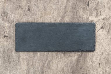 Tahta arkaplanın üzerine kopyalama alanı ile boş taş tahtayı yerleştir.