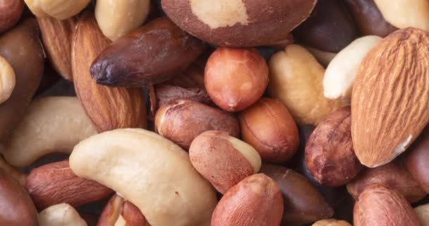 Closeup Top View Mixed Nuts Wooden Background Peanuts Brazilian Nuts — Stock Video