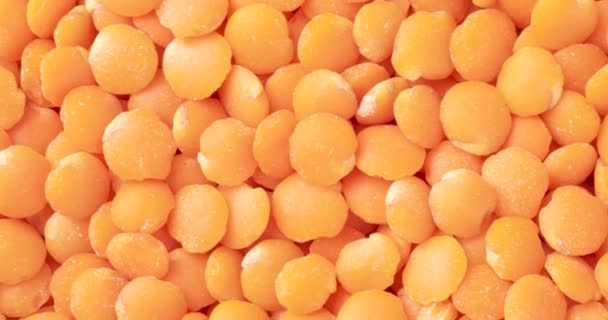 トップビュー オレンジレンズ豆の閉鎖 料理の背景 — ストック動画