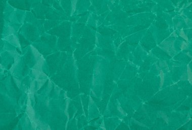 Koyu yeşil kağıt kırıntıları. Desenli arkaplan.