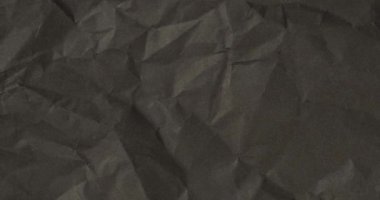 Kırışık siyah kağıtlar. Desenli arkaplan.