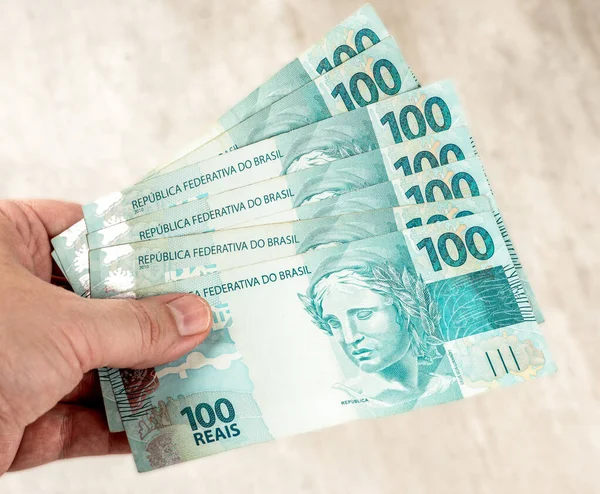 Hand Holding Hundred Brazilian Real Bills — Foto de Stock