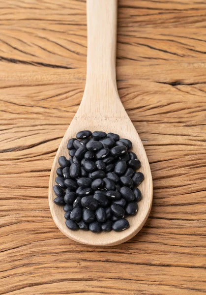 Black Beans Spoon Wooden Table — Stock Fotó