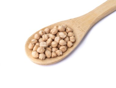 Chickpeas on a spoon isolated over white background.
