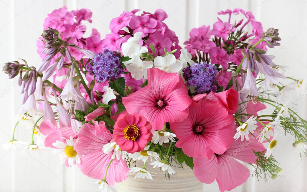bouquet of white pink and purple flowers close-up phlox daisies and others
