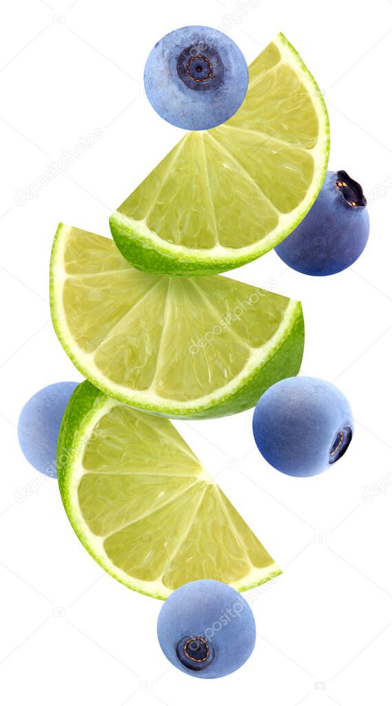 flying blueberries and lime sectors in the air, isolated on a white.