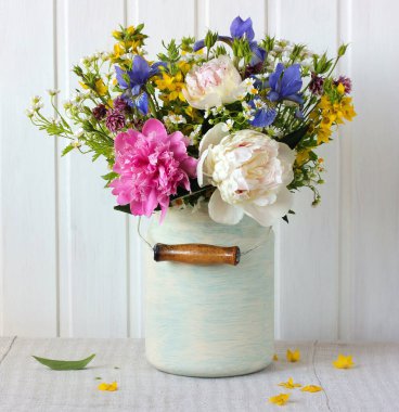 summer garden bouquet with peonies, daisies and irises