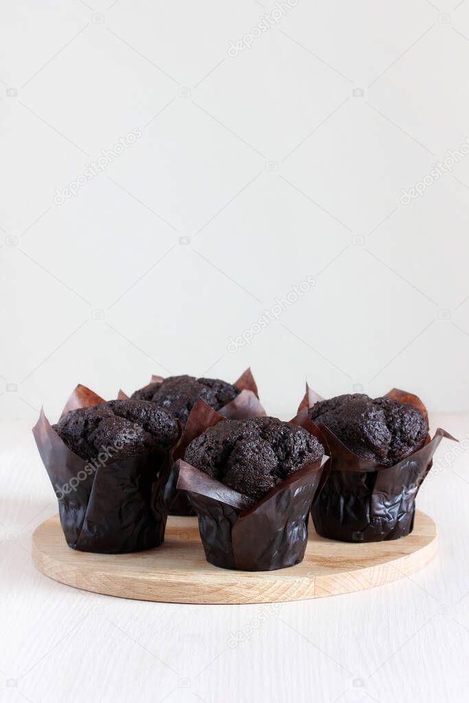 chocolate muffins on the table. sweet dessert, treats, cakes. copy space.