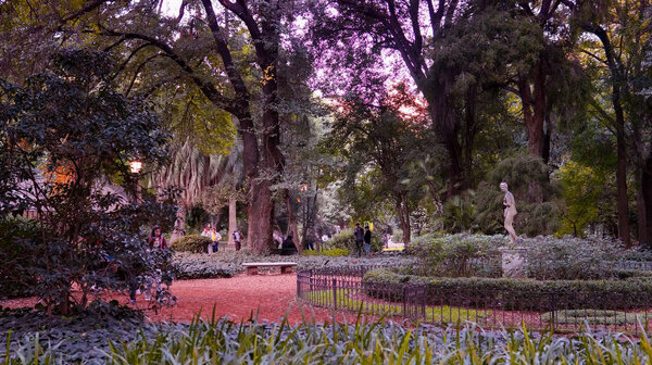 People enjoying a autumn warm afternoon at Carlos Thays botanical garden                 