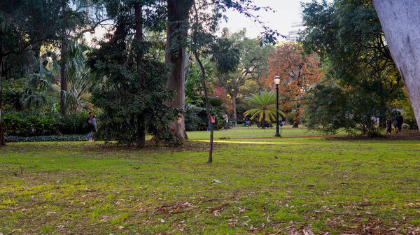  People enjoying a warm autumn afternoon in Carlos Thays botanical garden, Buenos Aires