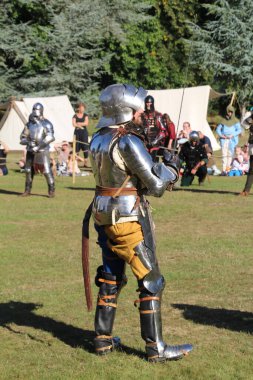 Hever, UK - 29 August, 2022: Re-enactment of medieval knights in armour on an ancient battlefield.