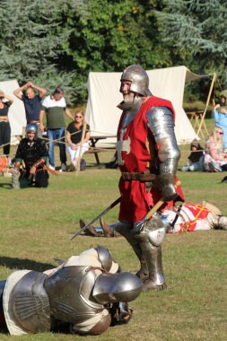Hever, UK - 29 August, 2022: Re-enactment of medieval knights in armour on an ancient battlefield.
