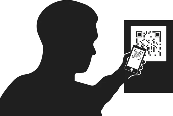 Bir kişinin silueti QR kodunu tarar.