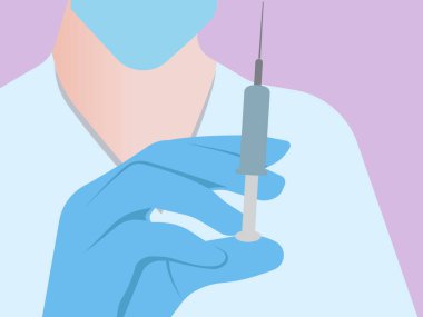 A doctor in a mask and glove with a syringe in his hand.