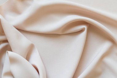 Katlı soyut bej kumaş dokusu. Boşluğu kopyala