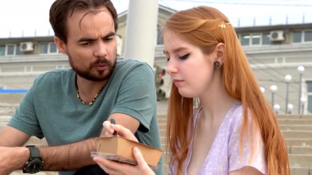 Young Couple Talking Each Other Eating Takeaway Food Paper Containers — Stock Video