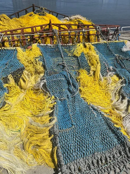 Yellow and blue commercial fishing nets