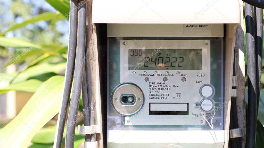 Smart meter on pole. Closeup dirty digital energy meter or smart meter that controls and communicates via RF radio with cell phones and Wi-Fi devices in real time with copy space. Selective focus