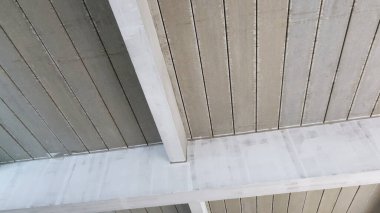 Precast concrete slabs on the ceiling. Prefabricated floor with rafters at the construction site with copy space. Selective focus