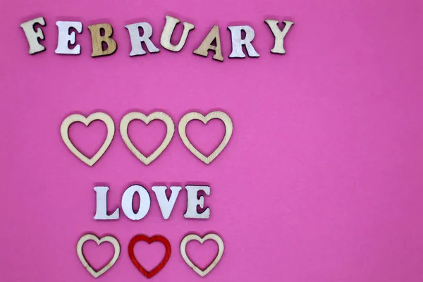Valentine Day Concept Wooden Letters Love Small Hearts Pink Background — 图库照片