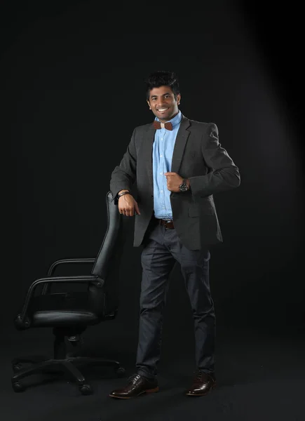 Smart Looking Businessman Leans Empty Office Chair Indicate Open Position —  Fotos de Stock