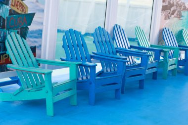 Blue empty chairs on Promenade
