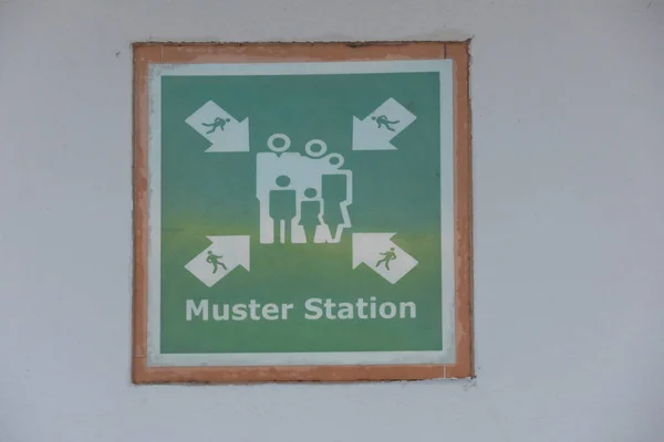 Cruise ship Muster station emergency sign for guest and crew togeather Muster station  sign on a wall