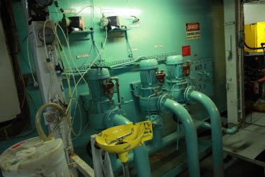 Cruise ship engine room interior with water tight doors electrical and diesel engines, water pipes, measuring instruments, diesel engines