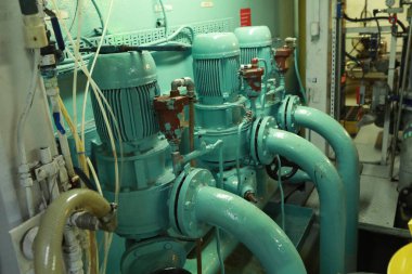 Cruise ship engine room interior with water tight doors electrical and diesel engines, water pipes, measuring instruments, diesel engines