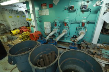 Cruise ship engine room interior with water tight doors electrical and diesel engines, water pipes, measuring instruments, diesel engines
