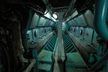 Cruise ship engine room interior with water tight doors electrical and diesel engines, water pipes, measuring instruments, diesel engines
