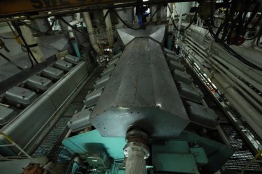 Cruise ship engine room interior with water tight doors electrical and diesel engines, water pipes, measuring instruments, diesel engines