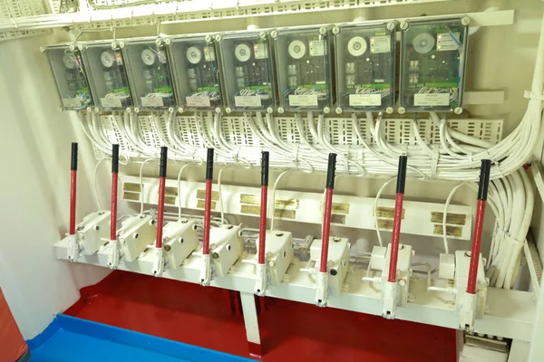 Cruise ship engine room interior with water tight doors electrical and diesel engines, water pipes, measuring instruments, diesel engines