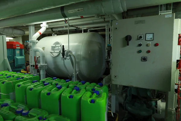 Cruise ship engine room interior with water tight doors electrical and diesel engines, water pipes, measuring instruments, diesel engines