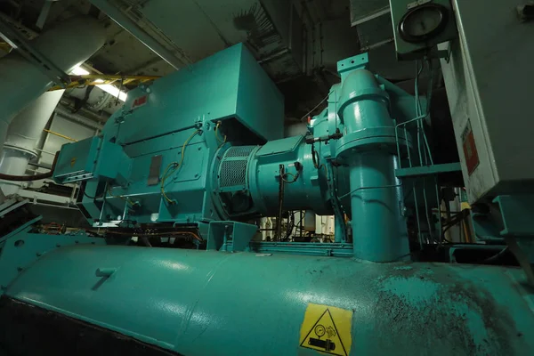 Cruise ship engine room interior with water tight doors electrical and diesel engines, water pipes, measuring instruments, diesel engines