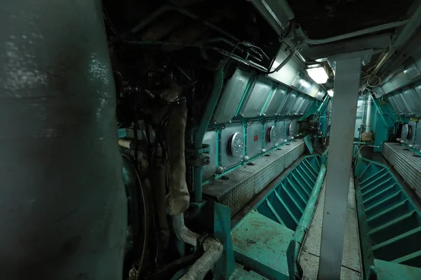 Cruise ship engine room interior with water tight doors electrical and diesel engines, water pipes, measuring instruments, diesel engines