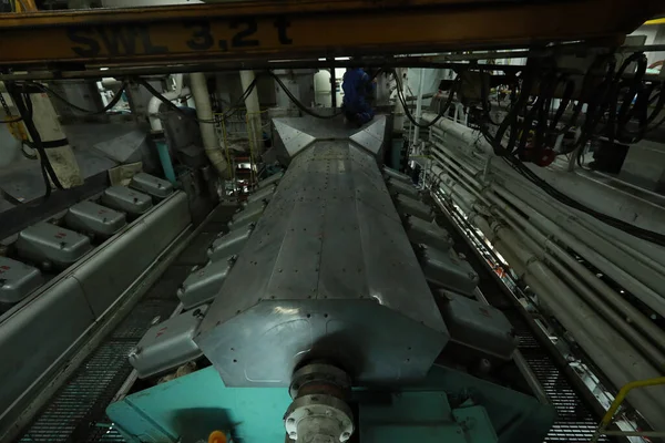 Cruise ship engine room interior with water tight doors electrical and diesel engines, water pipes, measuring instruments, diesel engines