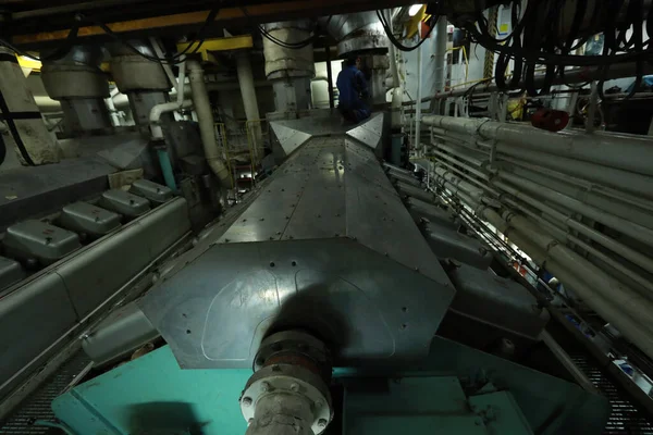 Cruise ship engine room interior with water tight doors electrical and diesel engines, water pipes, measuring instruments, diesel engines