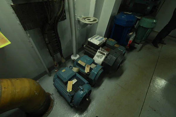 Cruise ship engine room interior with water tight doors electrical and diesel engines, water pipes, measuring instruments, diesel engines