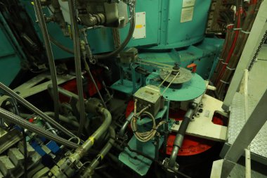 Cruise ship engine room interior with water tight doors electrical and diesel engines, water pipes, measuring instruments, diesel engines