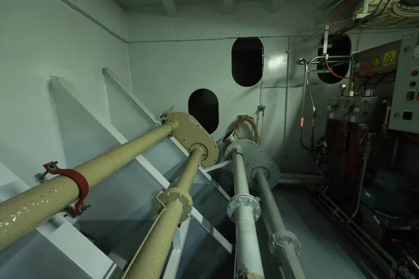 Cruise ship engine room interior with water tight doors electrical and diesel engines, water pipes, measuring instruments, diesel engines