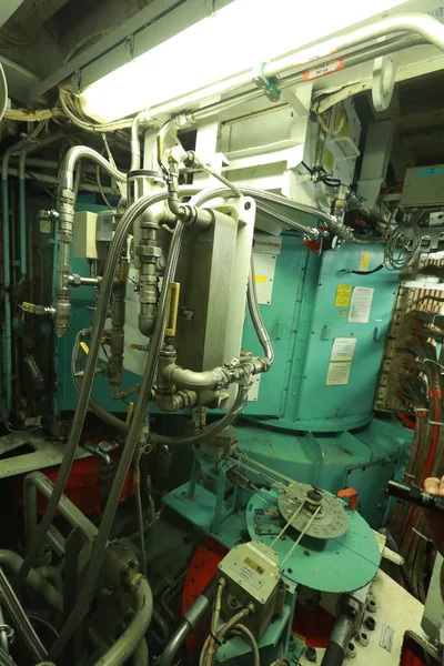 Cruise ship engine room interior with water tight doors electrical and diesel engines, water pipes, measuring instruments, diesel engines