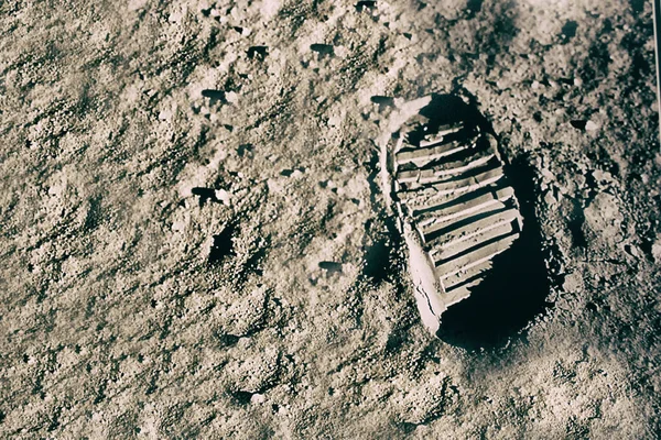 Astronaut\'s boot print on lunar (moon) landing mission. Elements of this image furnished by NASA.